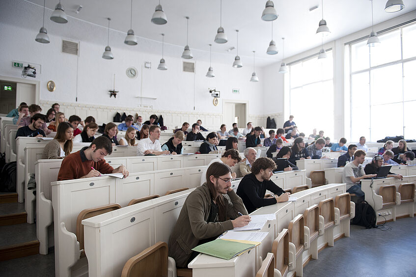Students listening to a seminar in a lecture hall.