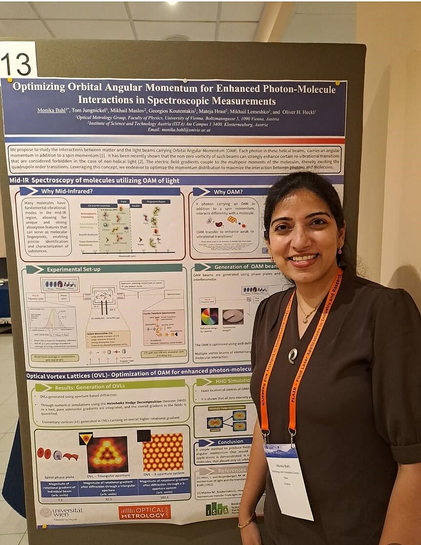 Monika Bahl in front of her poster.