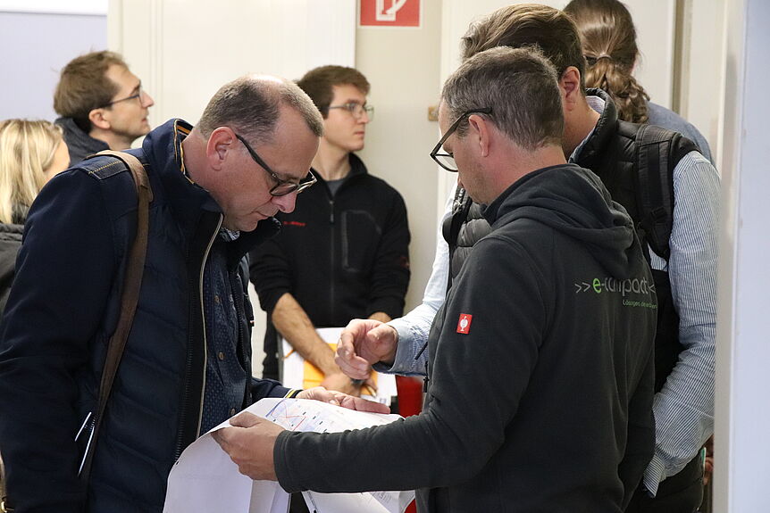 People of the construction team discussing their plans.