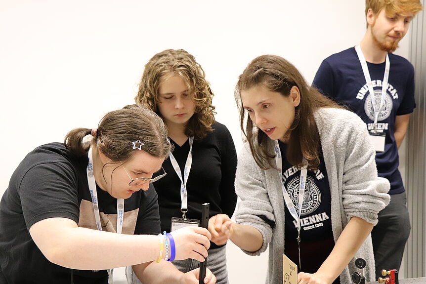 Some of the girls aligning a laser together.