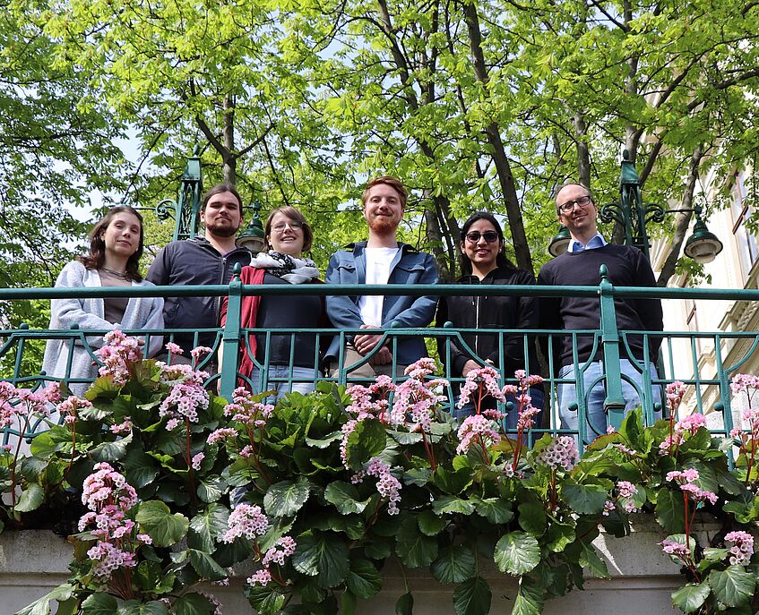 The team of research group P2 standing in a nice spring scenery.