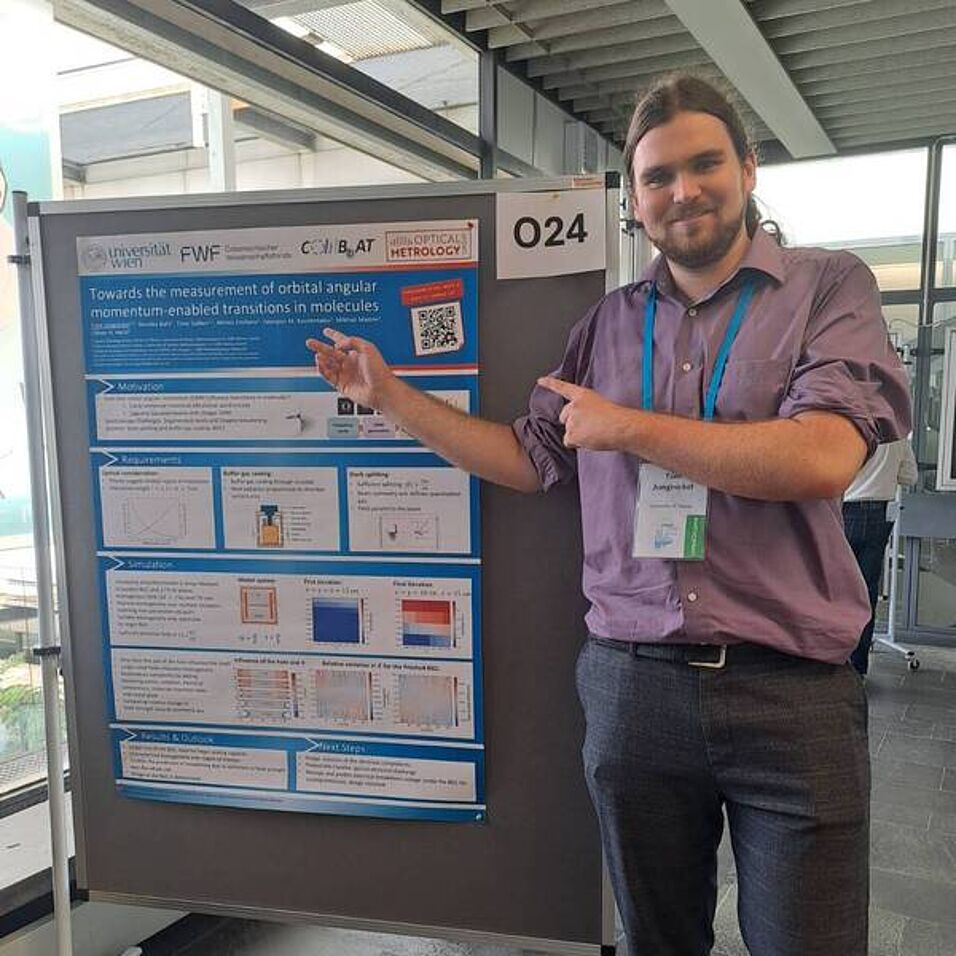 A scientist showing his poster.