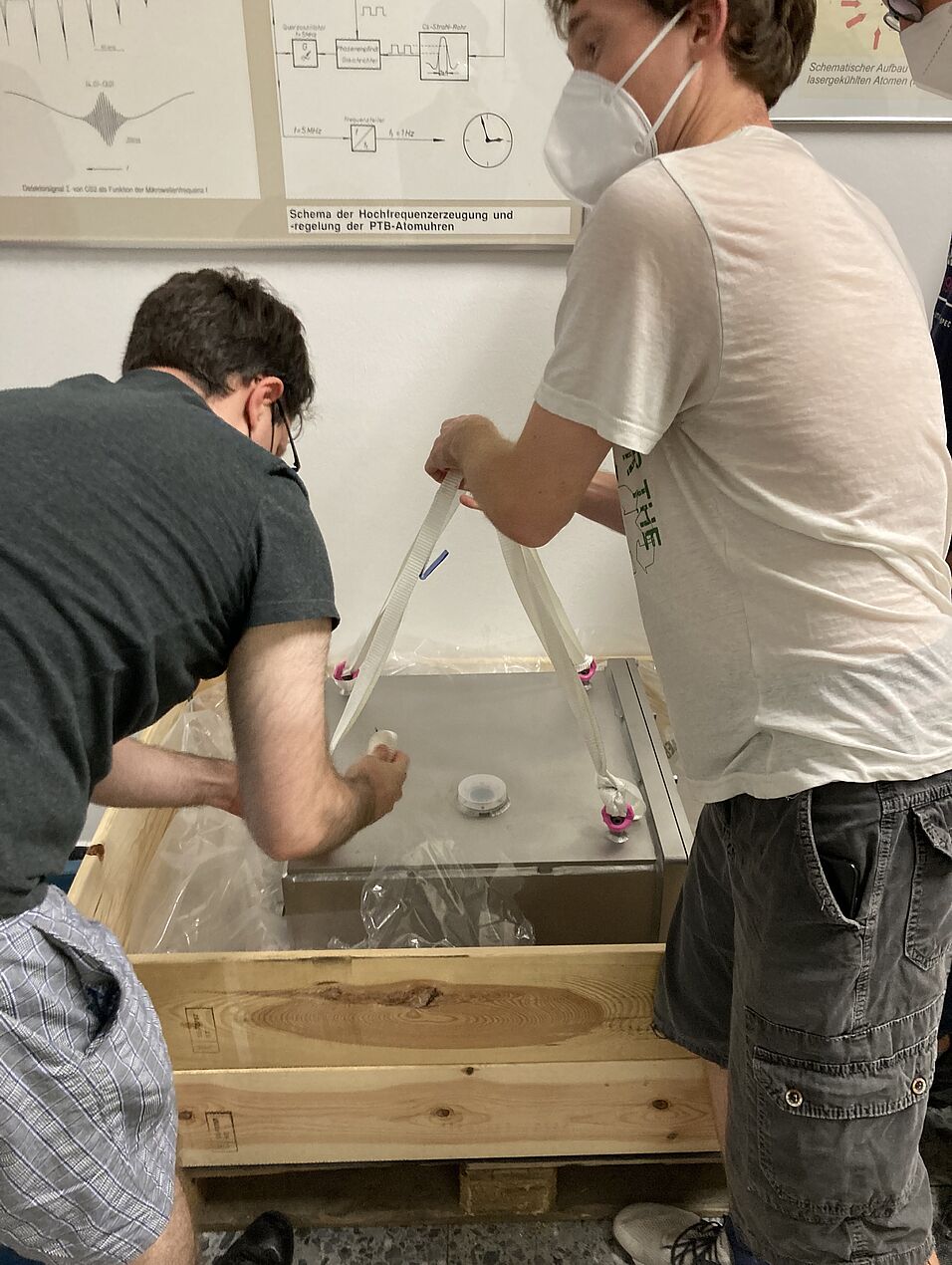 Team members moving equipment.