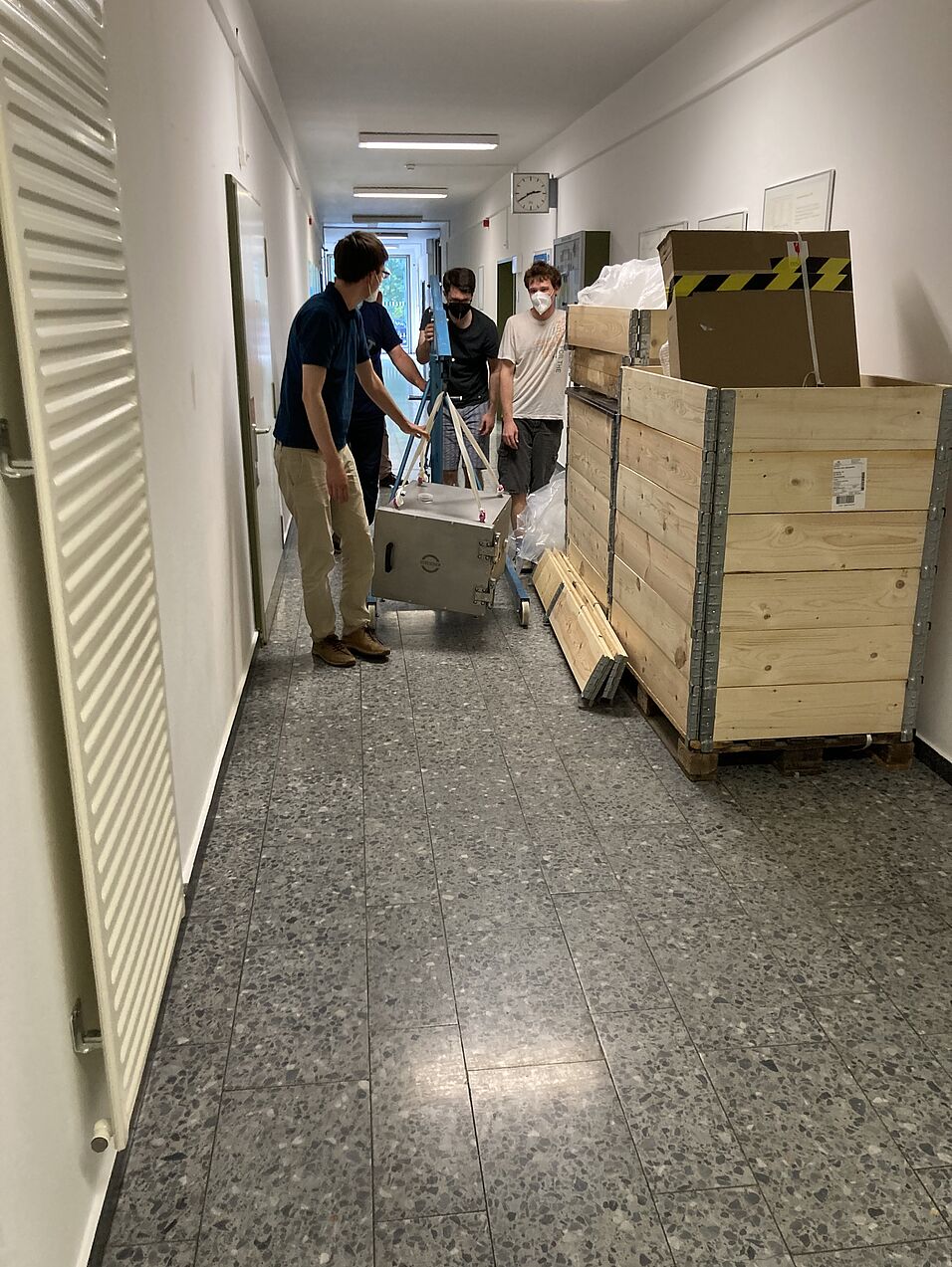 Team members moving equipment.