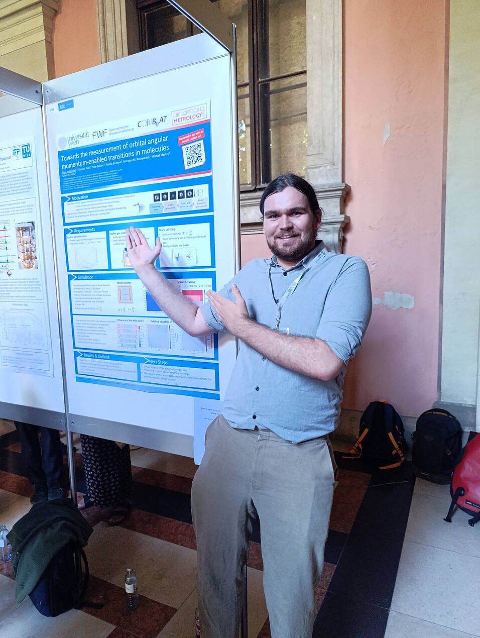 A scientist showing his poster.