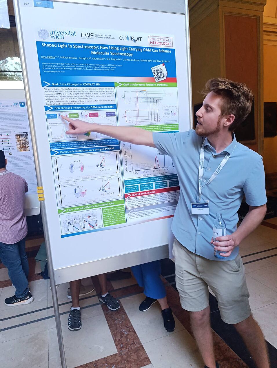 A scientist showing his poster.